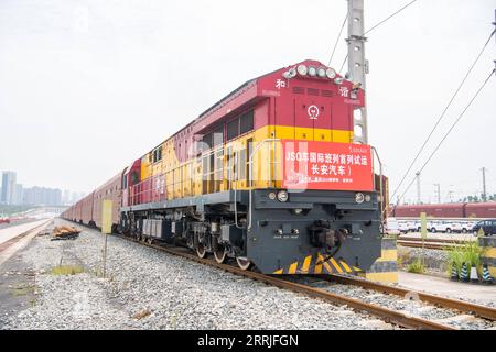 220721 -- CHONGQING, July 21, 2022 -- A JSQ freight vehicle of China Railway Special Cargo Logistics Co., Ltd. is about to leave Yuzui Station in southwest China s Chongqing, July 21, 2022. A JSQ freight vehicle of China Railway Special Cargo Logistics Co., Ltd., loaded with 207 cars manufactured by Changan Automobile, left Yuzui Station in southwest China s Chongqing on Thursday for its first pilot run to Moscow, Russia. Shipping time from Chongqing to Moscow will be reduced to 18 days using the China-Europe freight train service, compared to 35 days using marine shipping.  CHINA-CHONGQING-RU Stock Photo