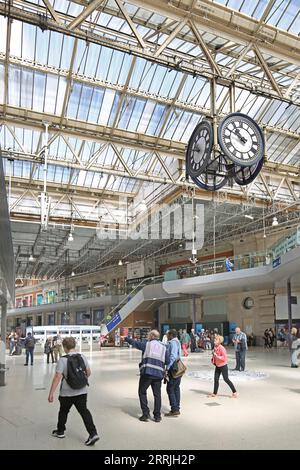 Main concourse at Waterloo Station, London, UK. Shows hanging scaffolding platforms for refurbishment and replacement of the roof glazing, summer 2023 Stock Photo