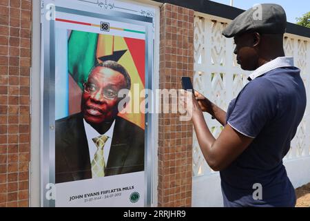 220725 -- ACCRA, July 25, 2022 -- A man takes a photo at a ceremony to commemorate the 10th anniversary of the death of former Ghanaian President John Evans Atta Mills in Accra, Ghana on July 24, 2022. Solemn ceremonies were held Sunday to commemorate the 10th anniversary of the death of former Ghanaian President John Evans Atta Mills, who died in office in 2012. Photo by /Xinhua GHANA-ACCRA-FORMER PRESIDENT-DEATH-ANNIVERSARY Seth PUBLICATIONxNOTxINxCHN Stock Photo