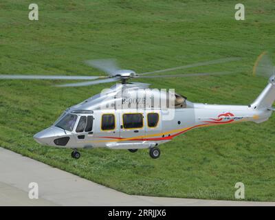 220727 -- HARBIN, July 27, 2022  -- Photo taken on July 26, 2022 shows a Z15 AC352 helicopter in Harbin, northeast China s Heilongjiang Province. The Civil Aviation Administration of China CAAC on Tuesday granted certification to the Z15 helicopter, the country s first homegrown, medium-sized helicopter model, for civil use. Z15, also known as AC352, was developed by AVIC Harbin Aircraft Industry Group Co., Ltd. under a cooperation program between AVIC and Airbus Helicopters. It can carry up to 16 passengers with a 7.5-tonne maximum take-off weight and a maximum range of 850 km.  CHINA-HEILONG Stock Photo