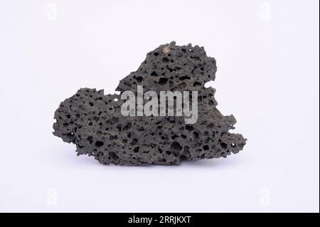 Vesicular basalt. Basalt is an extrusive igneus rock. This sample comes from Lanzarote Island, Canary Islands, Spain. Stock Photo