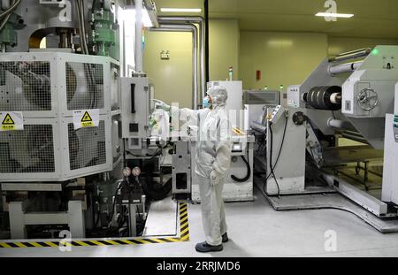 220730 -- HEFEI, July 30, 2022 -- A worker works on a power battery production line at a workshop of a battery production company in Hefei Economic and Technological Development Area in Hefei, east China s Anhui Province, July 29, 2022. In recent years, Hefei has promoted the power battery industry, a crucial part of new-energy vehicles industry, by developing and introducing power battery production companies.  CHINA-ANHUI-HEFEI-POWER BATTERY INDUSTRY CN LiuxJunxi PUBLICATIONxNOTxINxCHN Stock Photo