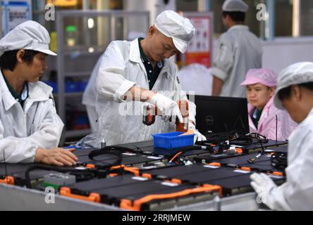 220730 -- HEFEI, July 30, 2022 -- Workers work on a power battery production line at a workshop of a battery production company in Hefei Economic and Technological Development Area in Hefei, east China s Anhui Province, July 29, 2022. In recent years, Hefei has promoted the power battery industry, a crucial part of new-energy vehicles industry, by developing and introducing power battery production companies.  CHINA-ANHUI-HEFEI-POWER BATTERY INDUSTRY CN LiuxJunxi PUBLICATIONxNOTxINxCHN Stock Photo