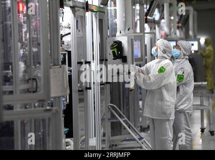 220730 -- HEFEI, July 30, 2022 -- Workers work on a power battery production line at a workshop of a battery production company in Hefei Economic and Technological Development Area in Hefei, east China s Anhui Province, July 29, 2022. In recent years, Hefei has promoted the power battery industry, a crucial part of new-energy vehicles industry, by developing and introducing power battery production companies.  CHINA-ANHUI-HEFEI-POWER BATTERY INDUSTRY CN LiuxJunxi PUBLICATIONxNOTxINxCHN Stock Photo