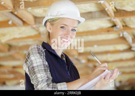 portrait of young beautiful designer in a construction site Stock Photo