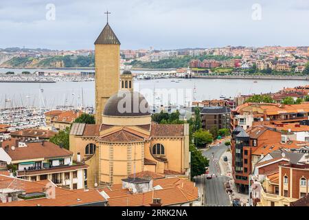 A view of the Our Lady of Las Mercedes Parish church built in the 1940s in the neo-Escurial style. Las Arenas, Getxo, Basque Country, Spain. Stock Photo