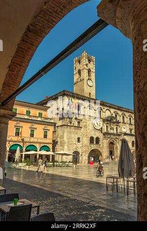 A glimpse of the Piazza del Popolo in Ascoli Piceno with the palace of the captains and the civic tower and the famous Meletti coffee Stock Photo