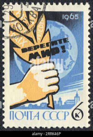 A postage stamp printed in USSR and shows The slogan 'Take care of Peace!', USSR 1965 Stock Photo