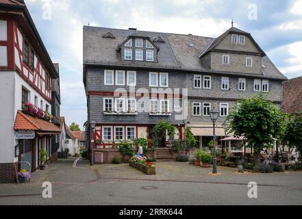 Amöneburg, Hesse, Germany - Old Town. Hotel Weber at the historical market place. Amöneburg is a small town in the central Hessian district of Marburg-Biedenkopf. It is located on the 365 m high mountain Amöneburg with the castle Amöneburg at the top. Stock Photo