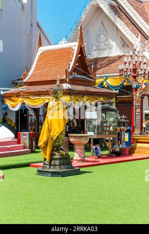 Buddha statue covered with gold leaf and cloth, Wat Intharawihan, Bangkok, Thailand, Asia Stock Photo