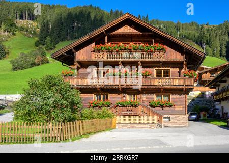 Austria, Tyrol, Zillertal, traditional house with flower boxes in Lanersbach. Stock Photo
