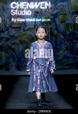 220912 -- BEIJING, Sept. 12, 2022 -- A model presents a creation by designer Chen Wen during the CHENWEN Studio fashion show of China Fashion Week S/S 2023 in Beijing, capital of China, Sept. 12, 2022.  CHINA-BEIJING-FASHION WEEK CN ChenxJianli PUBLICATIONxNOTxINxCHN Stock Photo