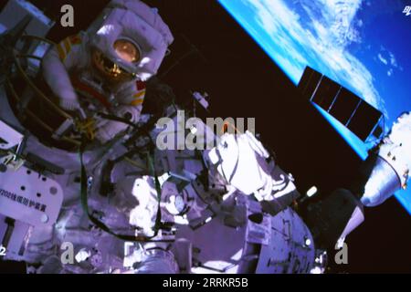 220917 -- BEIJING, Sept. 17, 2022 -- Screen image captured at Beijing Aerospace Control Center on Sept. 17, 2022 shows Shenzhou-14 astronaut Cai Xuzhe exiting the space station lab module Wentian to conduct extravehicular activities EVAs. China s Shenzhou-14 astronauts Cai Xuzhe and Chen Dong successfully exited the space station lab module Wentian on Saturday to conduct EVAs, according to the China Manned Space Agency CMSA.  EyesonSciCHINA-WENTIAN-SHENZHOU-14 ASTRONAUTS-EXTRAVEHICULAR ACTIVITIES CN GuoxZhongzheng PUBLICATIONxNOTxINxCHN Stock Photo