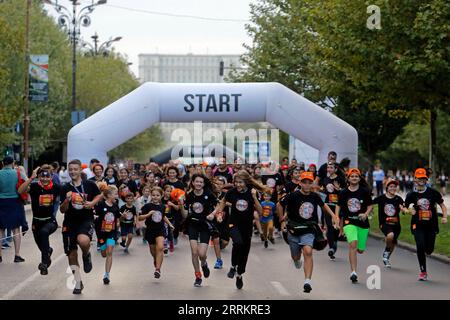 220918 -- BUCHAREST, Sept. 18, 2022 -- Runners start during the Color Run Night fun race in Bucharest, capital of Romania, Sept. 17, 2022. Photo by /Xinhua SPROMANIA-BUCHAREST-COLOR RUN NIGHT CristianxCristel PUBLICATIONxNOTxINxCHN Stock Photo
