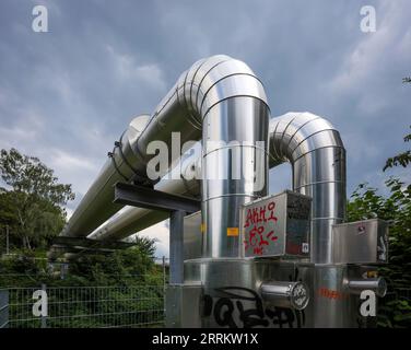 Essen, North Rhine-Westphalia, Germany - District heating pipeline in the Rüttenscheid district. The Osttrasse project crosses railroad tracks above g Stock Photo