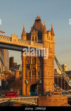 England, London, Tower Bridge and City of London Skyline and Red Double Decker Bus with Early Morning Light Stock Photo