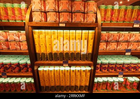 England, London, Piccadilly, Fortnum & Mason Store, Display of Colourful Biscuit Tins for The Coronation of King Charles III Stock Photo