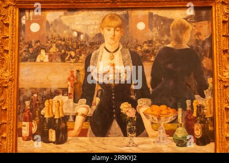 England, London, The Strand, Courtauld Gallery, Painting titled 'A Bar at the Folies-Bergere' by Edouard Manet dated 1882 Stock Photo