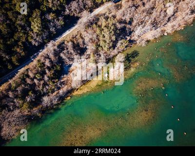 an aerial view of Mansfield Dam with crystal-clear blue water on a sunny day Stock Photo