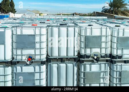 Containers authorized to transport dangerous liquids, called GRG/IBC (large bulk containers) . Stock Photo