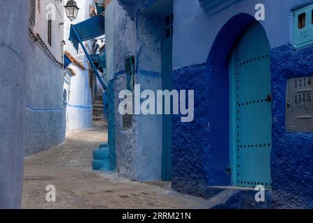 Vibrant blue colored alley in downtown Chefchaouen, Morocco Stock Photo