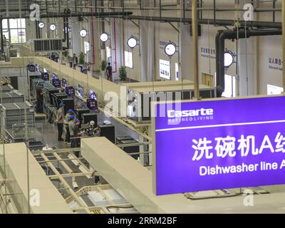 220925 -- CHONGQING, Sept. 25, 2022 -- Photo taken on Sept. 25, 2022 shows the production line of a dishwasher interconnected factory of Chongqing Haier Washing Electric Appliances Co.LTD in southwest China s Chongqing. A dishwasher interconnected factory of Chongqing Haier Washing Electric Appliances Co.LTD was officially put into production here at Gangcheng Industry Park in Jiangbei District of Chongqing on Sunday. This 42,000-square-meter factory, with a designed annual output of one million dishwashers, will utilize advanced technologies like 5G and Industrial Internet towards the digitiz Stock Photo