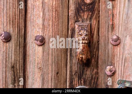 Beautiful small decoration of Fatima's hand at a door of a house in a Moroccan village in the Anti-Atlas Stock Photo