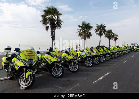 Police motorcycles lined up at the Tour of Britain cycle race Stage 6 start in Southend on Sea, Essex, UK, for rolling roadblock policing of event Stock Photo