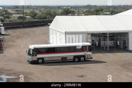 221012 -- EAGLE PASS U.S., Oct. 12, 2022 -- A bus carrying migrants departs from a U.S. Border Patrol processing facility in Eagle Pass, Texas, the United States, on Oct. 9, 2022. Buses carrying migrants from Republican-led border states continue to arrive in liberal bastions like New York, Washington, D.C., and Chicago, dragging the U.S. migrant crisis into the eye of the storm of partisan battles ahead of the November midterm elections. Photo by /Xinhua TO GO WITH World Insights: Migrants bused into storm eye of U.S. partisan fights amid midterms U.S.-TEXAS-EAGLE PASS-MIGRANTS-BUSES NickxWag Stock Photo