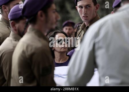 221012 -- GEDERA ISRAEL, Oct. 12, 2022 -- Soldiers and relatives attend the funeral of an Israeli soldier at the military cemetery in Gedera, central Israel, on Oct. 12, 2022. The Israeli soldier was killed in a drive-by shooting attack in the occupied West Bank on Tuesday, amid escalating violence between Israel and the Palestinians.  via Xinhua ISRAEL-GEDERA-SOLDIER-FUNERAL IlanxAssayag/JINI PUBLICATIONxNOTxINxCHN Stock Photo