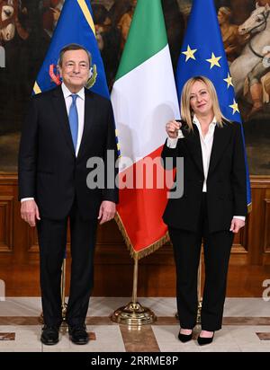 221024 -- ROME, Oct. 24, 2022 -- New Italian Prime Minister Giorgia Meloni R displays the bell handed over by outgoing Prime Minister Mario Draghi during the handover ceremony at Palazzo Chigi in Rome, Italy, Oct. 23, 2022. Giorgia Meloni on Sunday called for unity as she symbolically took power in a country that faced what she said were multiple challenges. Though Giorgia Meloni was sworn in on Saturday, outgoing Prime Minister Mario Draghi ceremonially passed power to her Sunday in a televised meeting at Palazzo Chigi, the official seat of Italy s government. Photo by /Xinhua ITALY-ROME-NEW Stock Photo