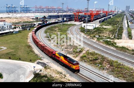 221103 -- QINZHOU, Nov. 3, 2022 -- This aerial photo taken on Sept. 17, 2022 shows a freight train departing from Qinzhou Port in Qinzhou, south China s Guangxi Zhuang Autonomous Region. In the first ten months of this year, the New International Land-Sea Trade Corridor saw 621,026 TEU containers transported by the railway intermodal freight trains, up 19.7 percent year on year.  CHINA-GUANGXI-TRADE CORRIDOR CN ZhangxAilin PUBLICATIONxNOTxINxCHN Stock Photo