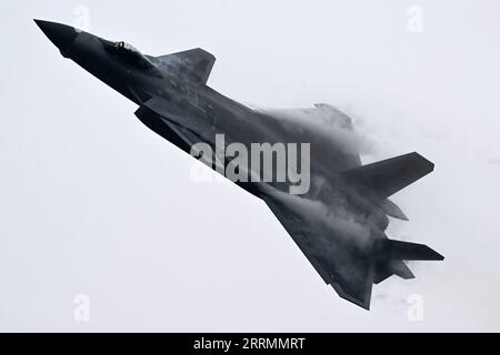 221107 -- GUANGZHOU, Nov. 7, 2022 -- A J-20 stealth fighter jet flies during a training for the upcoming 14th Airshow China in south China s Guangdong Province Nov. 5, 2022. The Chinese People s Liberation Army PLA Air Force will showcase an array of aircraft at the upcoming 14th Airshow China to be held from Nov. 8 to 13 in Zhuhai of Guangdong Province, a PLA Air Force spokesperson said on Sunday. Photo by /Xinhua CHINA-GUANGDONG-AIRSHOW-PREPARATION CN YuxHongchun PUBLICATIONxNOTxINxCHN Stock Photo