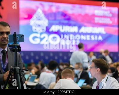 221115 -- BALI, Nov. 15, 2022 -- Journalists work at the media center for the 17th Group of 20 G20 Summit in Bali, Indonesia, Nov. 15, 2022. The G20 summit kicked off here on Tuesday, with issues pertaining to world economic recovery, world health systems and climate change taking the center stage.  INDONESIA-BALI-G20 SUMMIT-OPENING WangxYiliang PUBLICATIONxNOTxINxCHN Stock Photo