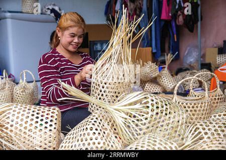 221117 -- BANGKOK, Nov. 17, 2022 -- A staff member makes a chalom in Chiang Mai, Thailand, on Nov. 9, 2022. TO GO WITH Feature: Young Thai designer revives ancient culture through APEC logo design  THAILAND-APEC LOGO DESIGN-CHALOM WangxTeng PUBLICATIONxNOTxINxCHN Stock Photo