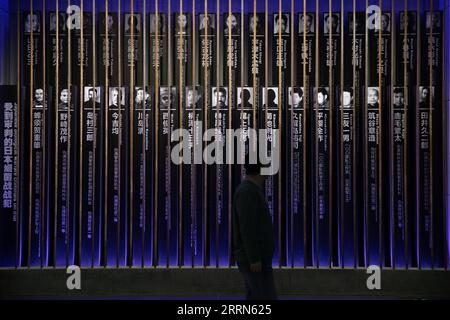 221214 -- HARBIN, Dec. 14, 2022 -- A staff member works at an exhibition hall at the Museum of Evidence of War Crimes by the Japanese Army Unit 731 in Harbin, capital of northeast China s Heilongjiang Province, Dec. 10, 2022. More than 20,000 pieces of artifacts and documents are on exhibit for the first time in a museum in northeast China s Heilongjiang Province, testifying crimes against humanity by the notorious Japanese germ warfare army known as Unit 731 during the World War II. Following a preparation since September, the Museum of Evidence of War Crimes by the Japanese Army Unit 731 in Stock Photo