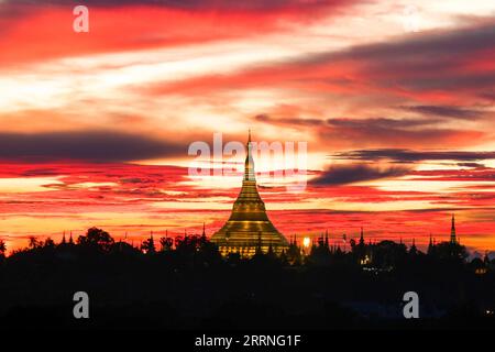 230110 -- BEIJING, Jan. 10, 2023 -- This photo taken on Sept. 1, 2022 shows the sunset behind Shwedagon Pagoda in Yangon, Myanmar. Photo by /Xinhua XINHUA-PICTURES OF THE YEAR 2022-WORLD NEWS MyoxKyawxSoe PUBLICATIONxNOTxINxCHN Stock Photo
