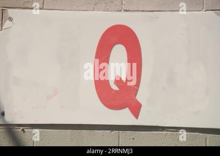 Old worn letter Q, showing its age, pattern, lines and boldly grabbing attention.  Be noticed with this single letter, Stock Photo