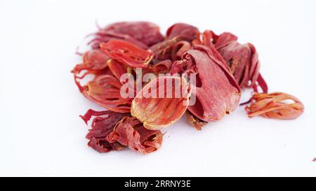 Macro close-up of Organic mace Myristica fragrans on white background. Pile of Indian Aromatic Spice. Stock Photo