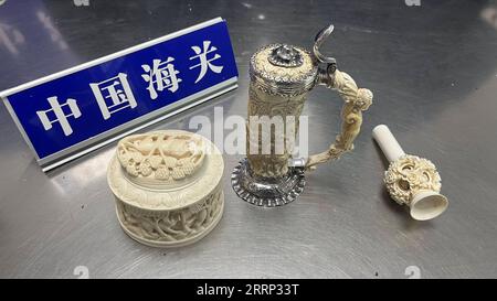 230214 -- CHANGSHA, Feb. 14, 2023 -- This photo taken on Feb. 9, 2023 shows ivory items seized from an imported package in Changsha, capital of central China s Hunan Province. Customs officials have seized three ivory items weighing about 1 kg in total from an imported package in Changsha. The seizure made on Feb. 9 was the largest of its kind reported by Changsha Customs since 2020, according to customs officials. Changsha Customs/Handout via Xinhua CHINA-HUNAN-CHANGSHA-CUSTOMS-IVORY ITEMS-SEIZURE CN ZhangxYujie PUBLICATIONxNOTxINxCHN Stock Photo