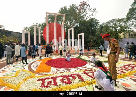 230221 -- DHAKA, Feb. 21, 2023 -- Volunteers decorate the Central Shaheed Minar, a solemn and iconic monument, in Dhaka, Bangladesh on Feb. 21, 2023. Hundreds of thousands of people in Bangladeshi capital Dhaka Tuesday paid tributes to the country s language movement activists who sacrificed their lives on the day in 1952. BANGLADESH-DHAKA-INTERNATIONAL MOTHER LANGUAGE DAY Salim PUBLICATIONxNOTxINxCHN Stock Photo