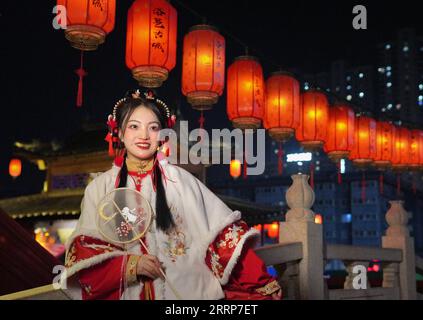 230227 -- LUOYANG, Feb. 27, 2023 -- A tourist poses for photos at Luoyi ancient city in Luoyang, central China s Henan Province, Feb. 22, 2023. Official data showed that the city saw 10.31 million trips in January of 2023, generating 6.28 billion yuan about 902.44 million U.S. dollars in revenue, up 746.63 percent and 690.06 percent year on year respectively.  CHINA-HENAN-LUOYANG-CULTURAL AND TOURISM INDUSTRY CN LixAn PUBLICATIONxNOTxINxCHN Stock Photo