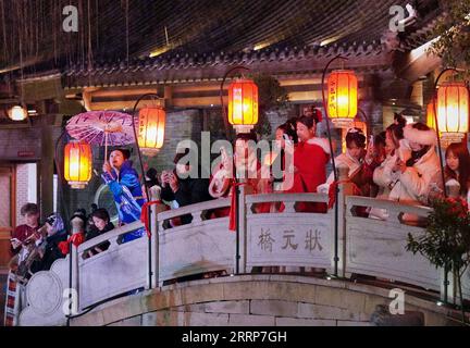 230227 -- LUOYANG, Feb. 27, 2023 -- Tourists visit Luoyi ancient city in Luoyang, central China s Henan Province, Feb. 22, 2023. Official data showed that the city saw 10.31 million trips in January of 2023, generating 6.28 billion yuan about 902.44 million U.S. dollars in revenue, up 746.63 percent and 690.06 percent year on year respectively.  CHINA-HENAN-LUOYANG-CULTURAL AND TOURISM INDUSTRY CN LixAn PUBLICATIONxNOTxINxCHN Stock Photo