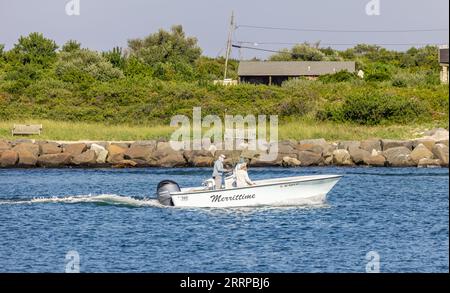 group of guys coming into montauk aboard teh merrittime outboard boat Stock Photo