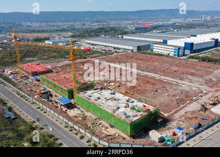 230314 -- CHONGQING, March 14, 2023 -- This aerial photo taken on March 13, 2023 shows a view of a construction site of the Chongqing Donggang automotive electronics industrial park in southwest China s Chongqing Municipality. The project will accelerate the transformation and upgrading of the automotive industry in Chongqing.  CHINA-CHONGQING-AUTOMOTIVE ELECTRONICS PARK CN TangxYi PUBLICATIONxNOTxINxCHN Stock Photo