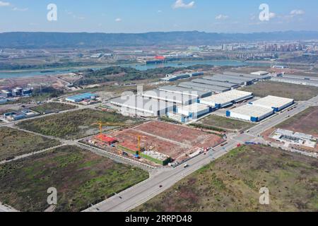 230314 -- CHONGQING, March 14, 2023 -- This aerial photo taken on March 13, 2023 shows a view of a construction site of the Chongqing Donggang automotive electronics industrial park in southwest China s Chongqing Municipality. The project will accelerate the transformation and upgrading of the automotive industry in Chongqing.  CHINA-CHONGQING-AUTOMOTIVE ELECTRONICS PARK CN TangxYi PUBLICATIONxNOTxINxCHN Stock Photo