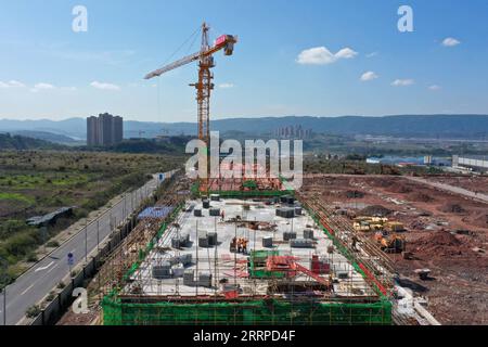 230314 -- CHONGQING, March 14, 2023 -- This aerial photo taken on March 13, 2023 shows a view of a construction site of the Chongqing Donggang automotive electronics industrial park in southwest China s Chongqing Municipality. The project will accelerate the transformation and upgrading of the automotive industry in Chongqing.  CHINA-CHONGQING-AUTOMOTIVE ELECTRONICS PARK CN TangxYi PUBLICATIONxNOTxINxCHN Stock Photo