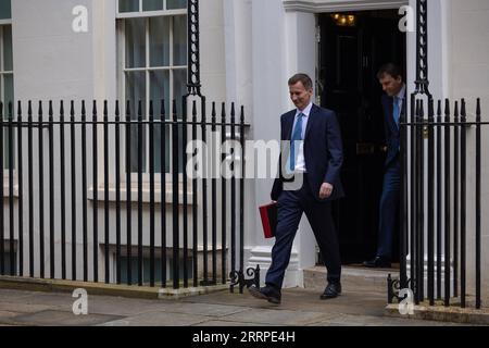 230316 -- LONDON, March 16, 2023 -- Chancellor of the Exchequer Jeremy Hunt of the United Kingdom UK leaves 11 Downing Street to deliver his budget to Parliament, in London, Britain, on March 15, 2023. UK on Wednesday unveiled a clutch of measures to boost its struggling economy, including childcare reforms, tax cuts for businesses, and policies to ease the cost-of-living burden for households. /No. 10 Downing Street/Handout via Xinhua BRITAIN-LONDON-JEREMY HUNT-BUDGET SimonxWalker PUBLICATIONxNOTxINxCHN Stock Photo