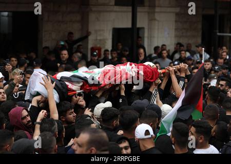 230323 -- TULKARM, March 23, 2023 -- Mourners carry the body of Amir Imar Abu Khadijeh during his funeral in the West Bank city of Tulkarm, March 23, 2023. A Palestinian was killed on Thursday by Israeli soldiers during an Israeli raid in the northern West Bank, Palestinian medics and Israeli sources said. Photo by /Xinhua MIDEAST-TULKARM-FUNERAL AymanxNobani PUBLICATIONxNOTxINxCHN Stock Photo