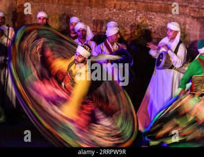 230413 -- CAIRO, April 13, 2023 -- Dancers perform Tanoura, a traditional Egyptian folk dance, during the holy month of Ramadan at the Sultan Al-Ghuri complex in Cairo, Egypt, on April 12, 2023. Tanoura is an Arabic word, which means skirt in English. Tanoura dance is a traditional folk dance in Egypt, where the dancer in colorful skirts spins to the tunes of songs.  EGYPT-CAIRO-RAMADAN-TANOURA DANCE AhmedxGomaa PUBLICATIONxNOTxINxCHN Stock Photo